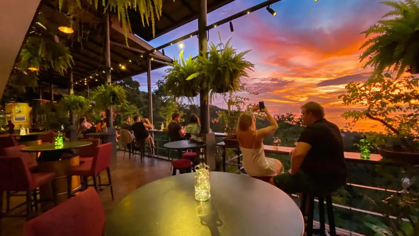 Guests enjoying sunset views at The Gold Bar Koh Tao